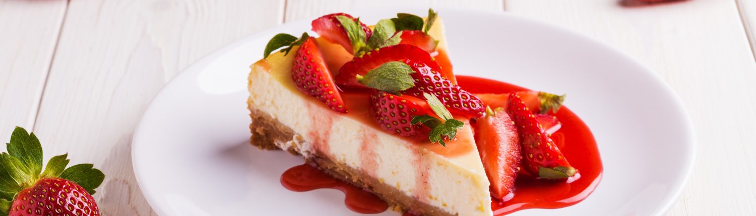 Delicious,Homemade,Cheesecake,With,Strawberries,On,White,Wooden,Table.