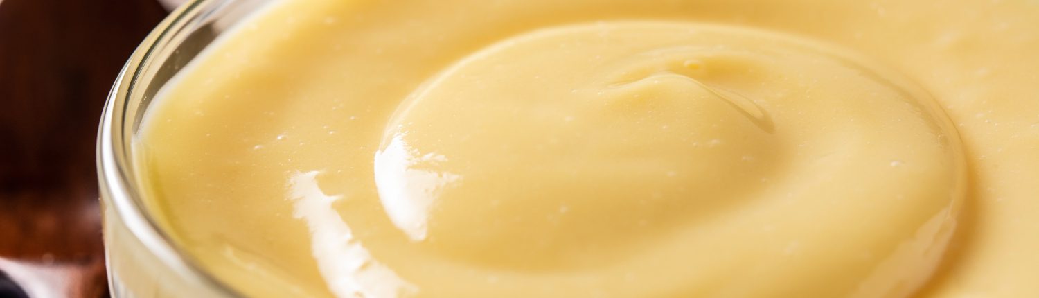 Pastry,Cream,In,A,Bowl,On,Wooden,Table